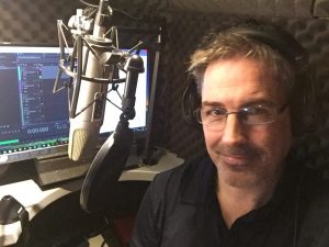 Simon Morgan voice over artist in sound proof recording booth